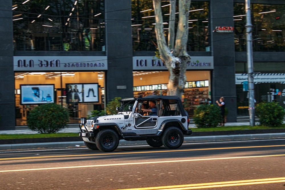 black and white jeep wrangler on road during daytime