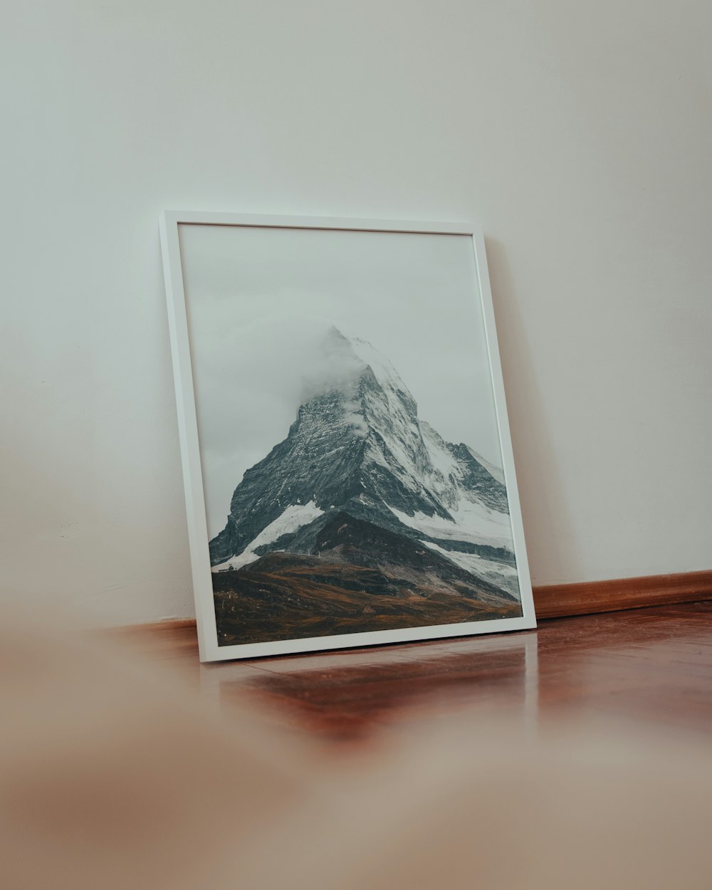 white wooden framed painting of mountain