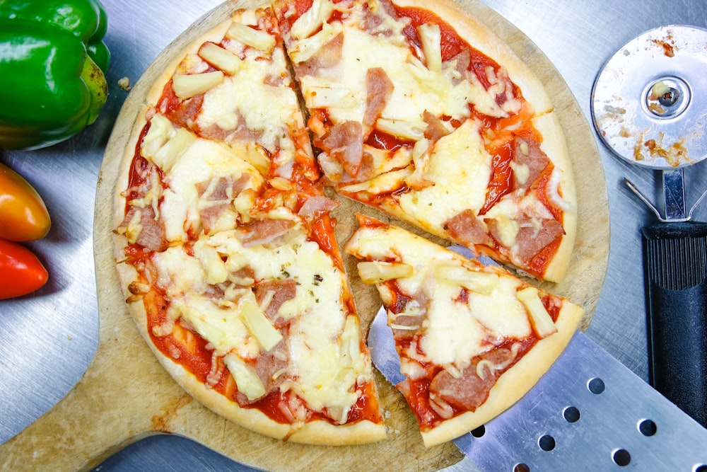 pizza on brown wooden round plate