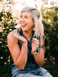 woman in black tank top smiling