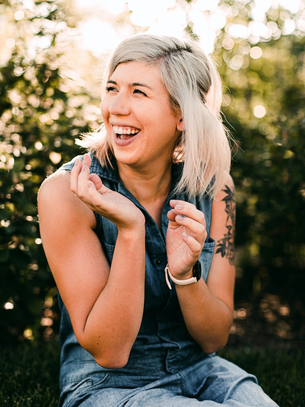 woman in black tank top smiling