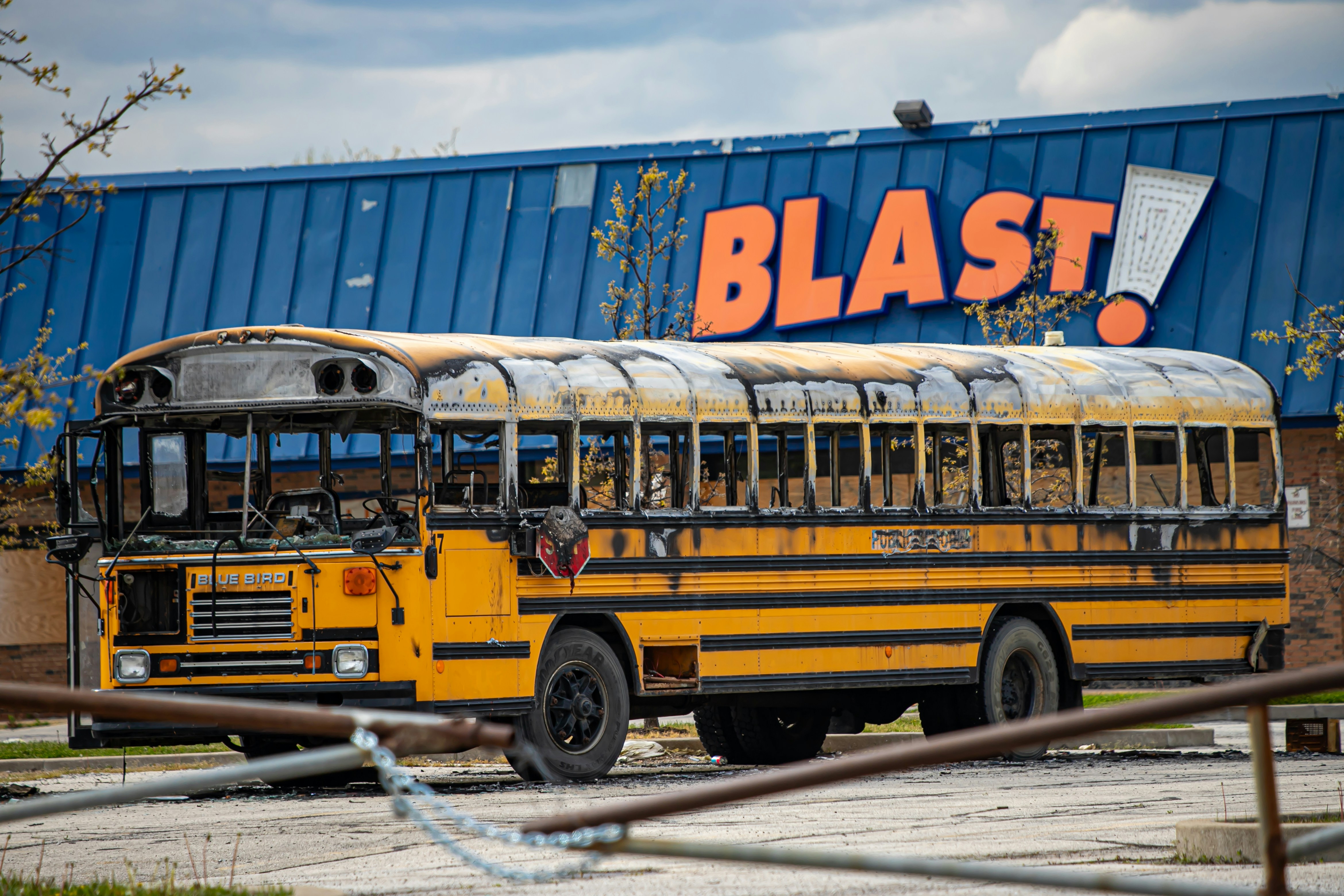 school bus parked near white building during daytime