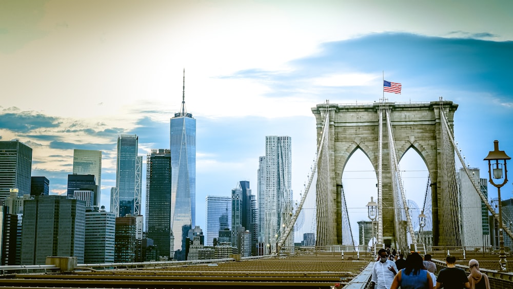 people walking on bridge during daytime