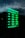 A digital sign displays business hours in glowing green text against a dark background. The days of the week are listed, with varying opening hours from Tuesday to Saturday and closures on Sunday and Monday. The sky and part of a building are faintly visible in the reflection.