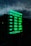 A digital sign displays business hours in glowing green text against a dark background. The days of the week are listed, with varying opening hours from Tuesday to Saturday and closures on Sunday and Monday. The sky and part of a building are faintly visible in the reflection.