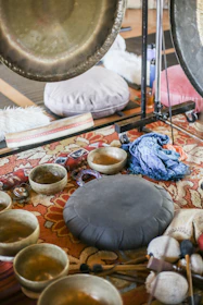 black round table with blue and white textile