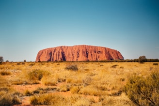 brown rock formation under blue sky during daytime