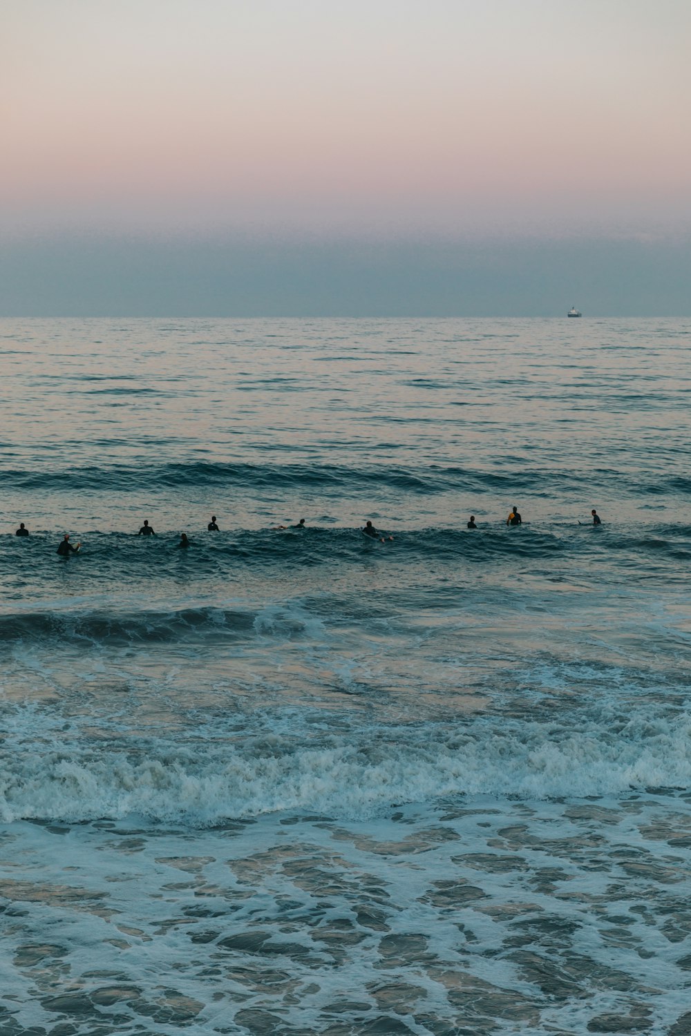 sea waves under gray sky during daytime