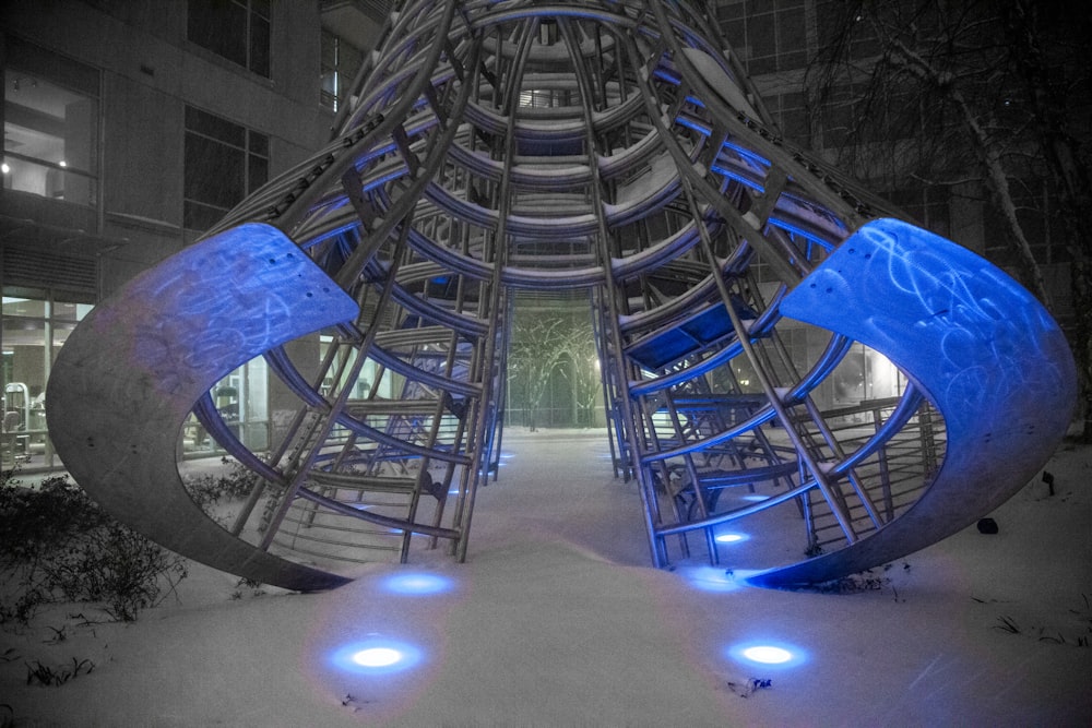 blue metal spiral stairs during night time