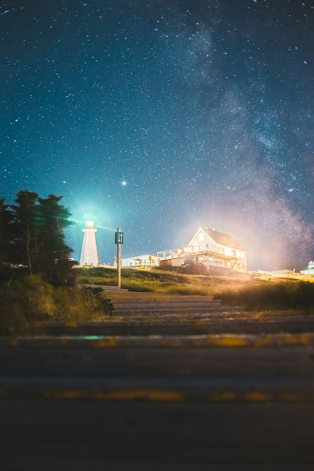 white and brown house under starry night