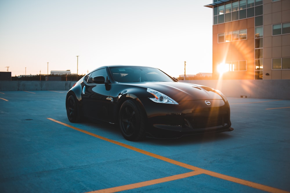 black porsche 911 parked on parking lot during night time