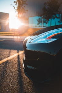 A car with tinted windows parked under sunlight, showcasing the tint's effectiveness.