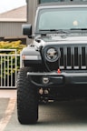 black jeep wrangler on road during daytime
