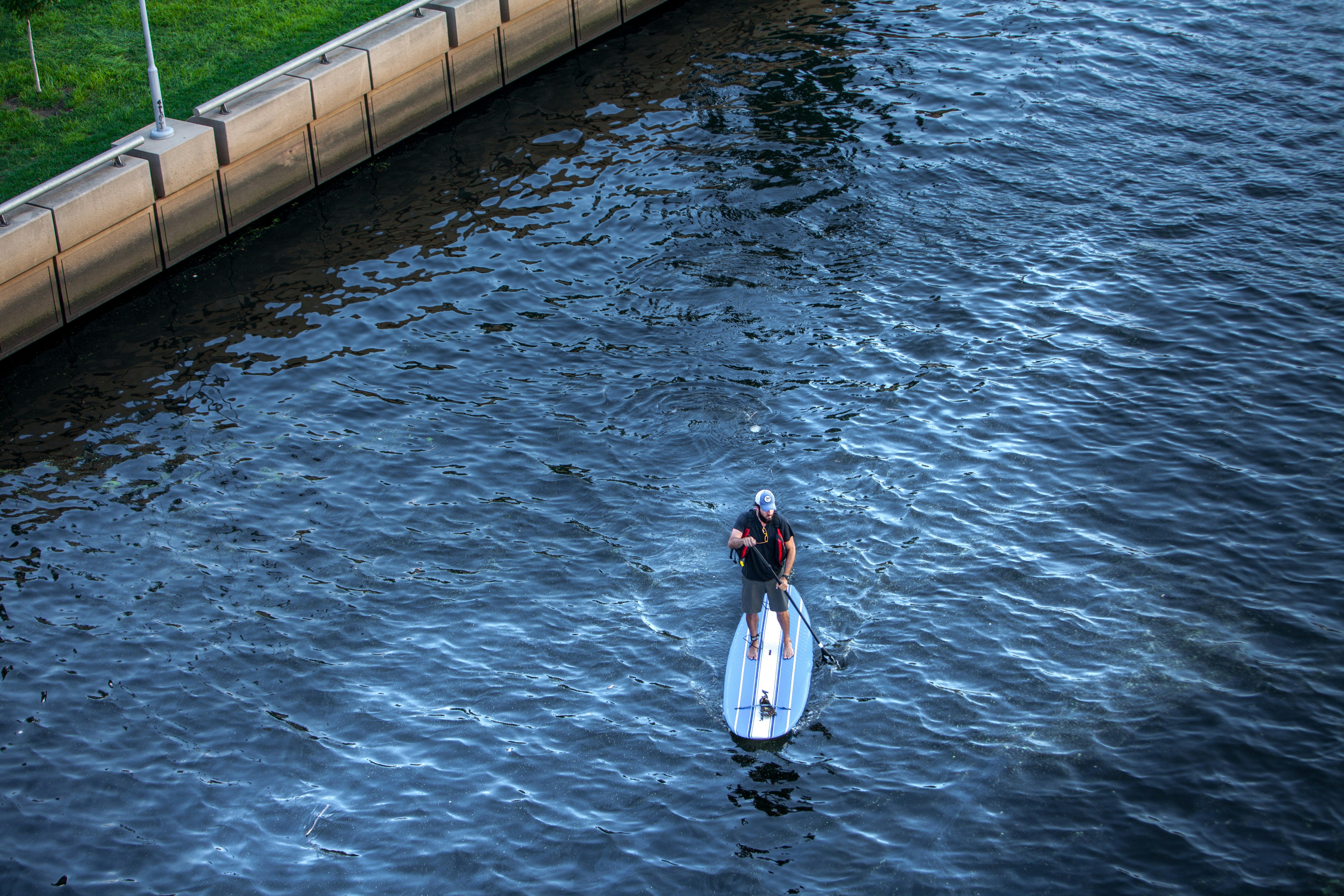 woman in white and red dress on water during daytime