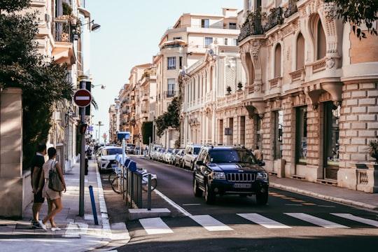 cars parked on sidewalk near buildings during daytime in Nice France