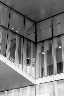 Facade detail showing the integration of glass and aluminum elements in a contemporary building exterior.