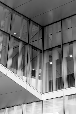 A modern building facade showcasing elegant glass and aluminium elements.