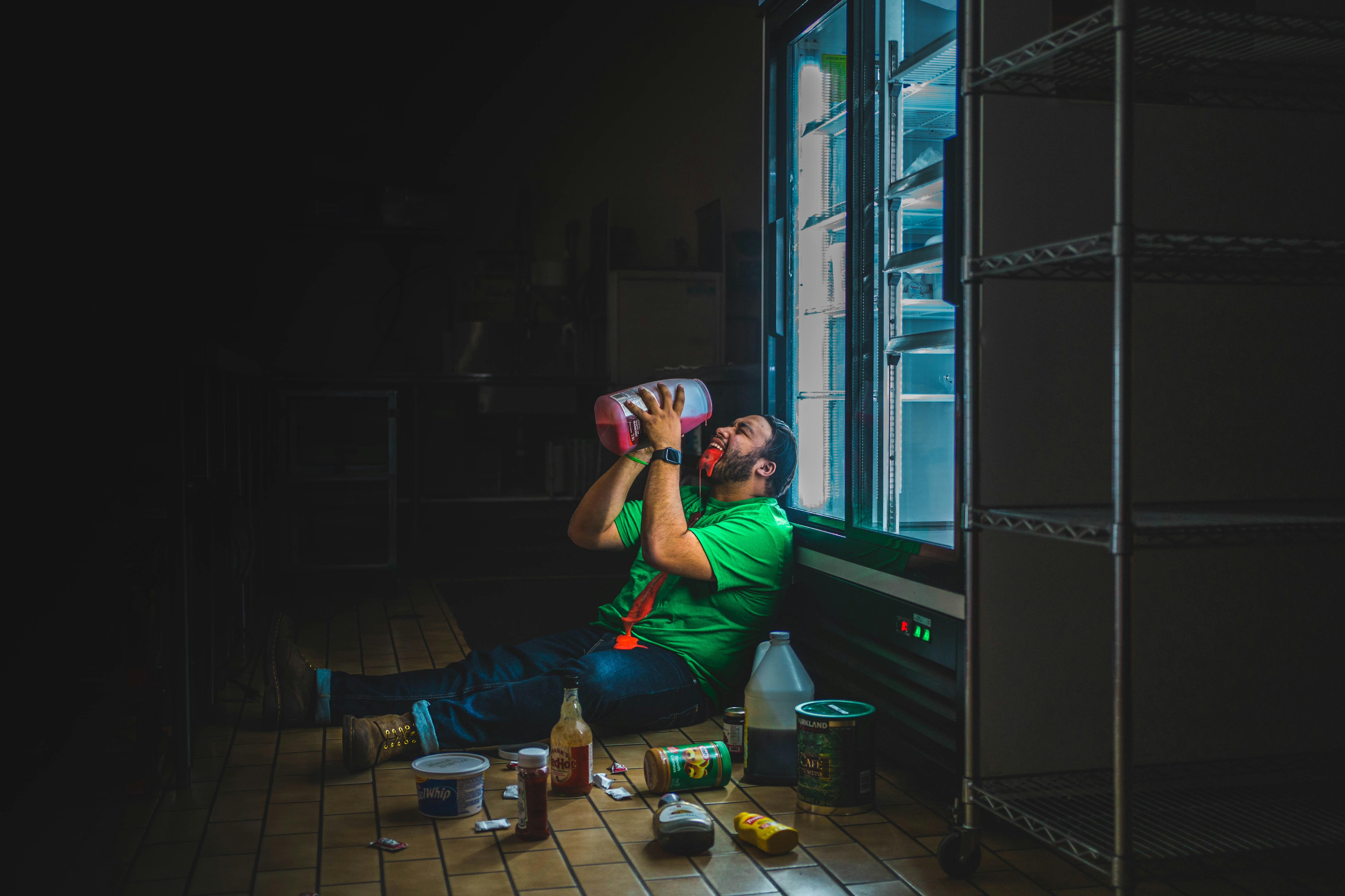 A happy couple sitting together at a table, focused on a fun and creative DIY craft project during a relaxed date night at home.