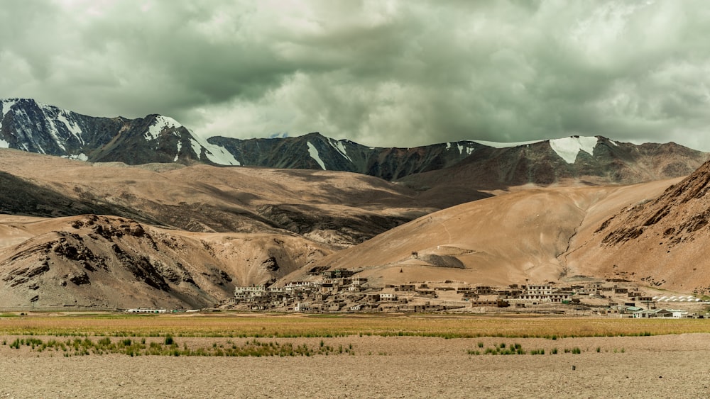 brown and gray mountains under white sky during daytime