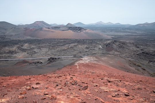 brown and gray mountains during daytime in Timanfaya National Park Spain