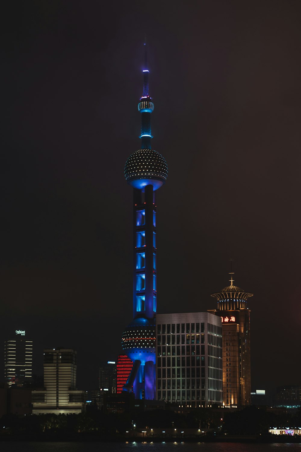 white and blue tower during night time