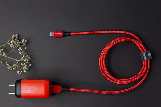 Elegant display of premium charging cables coiled neatly on a white marble surface