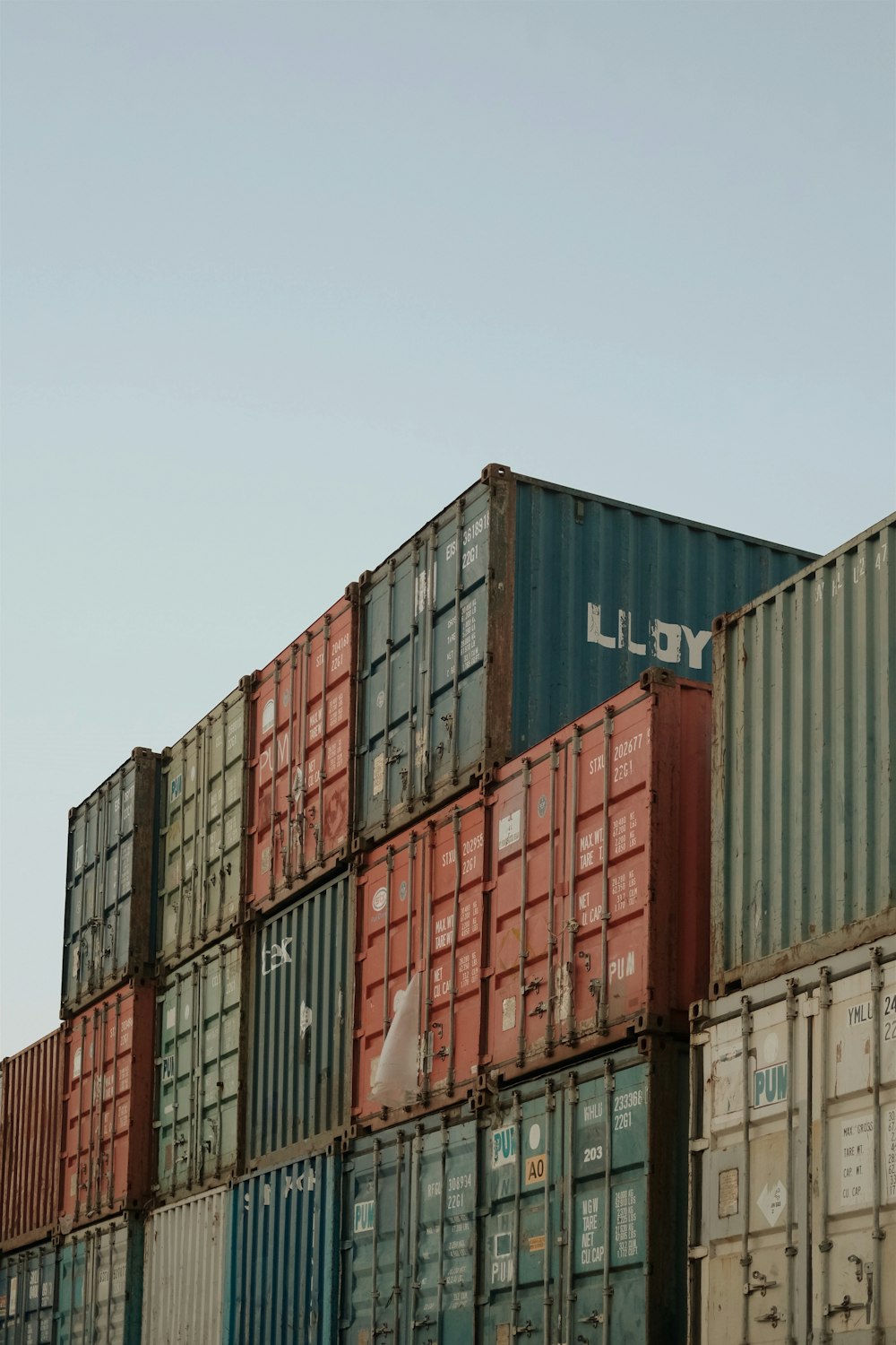 blue red and yellow cargo containers