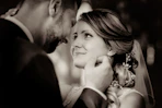 man and woman kissing each other