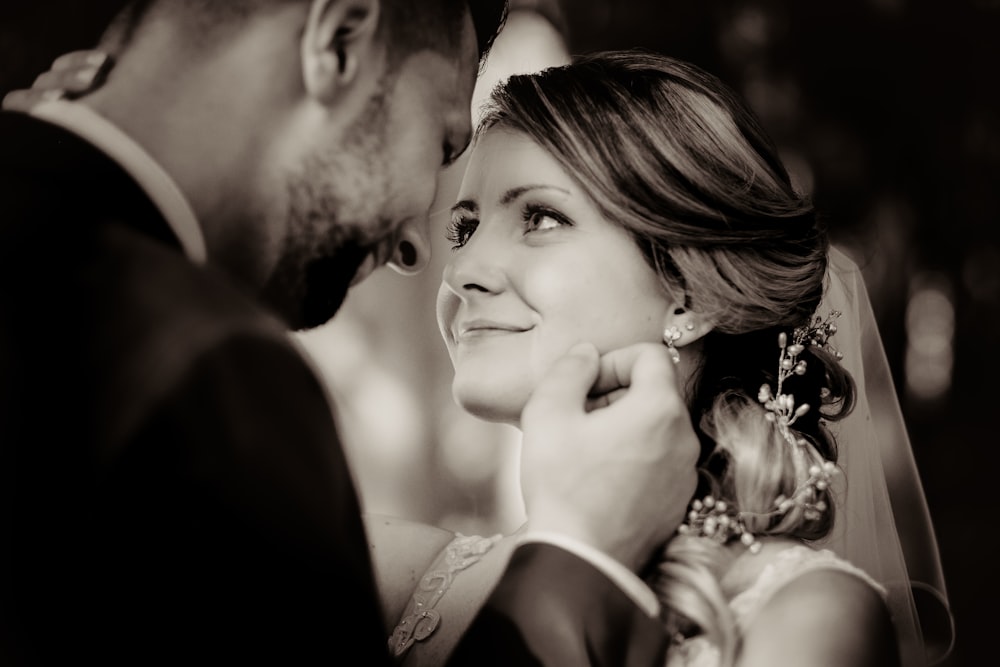 man and woman kissing each other