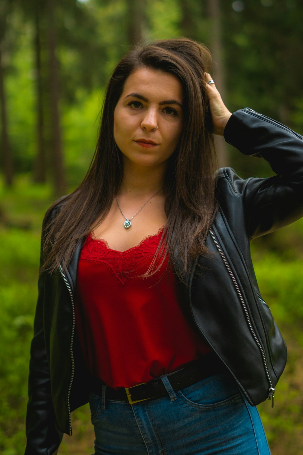 Woman in black leather jacket and red top photo – Free Clothing Image on  Unsplash