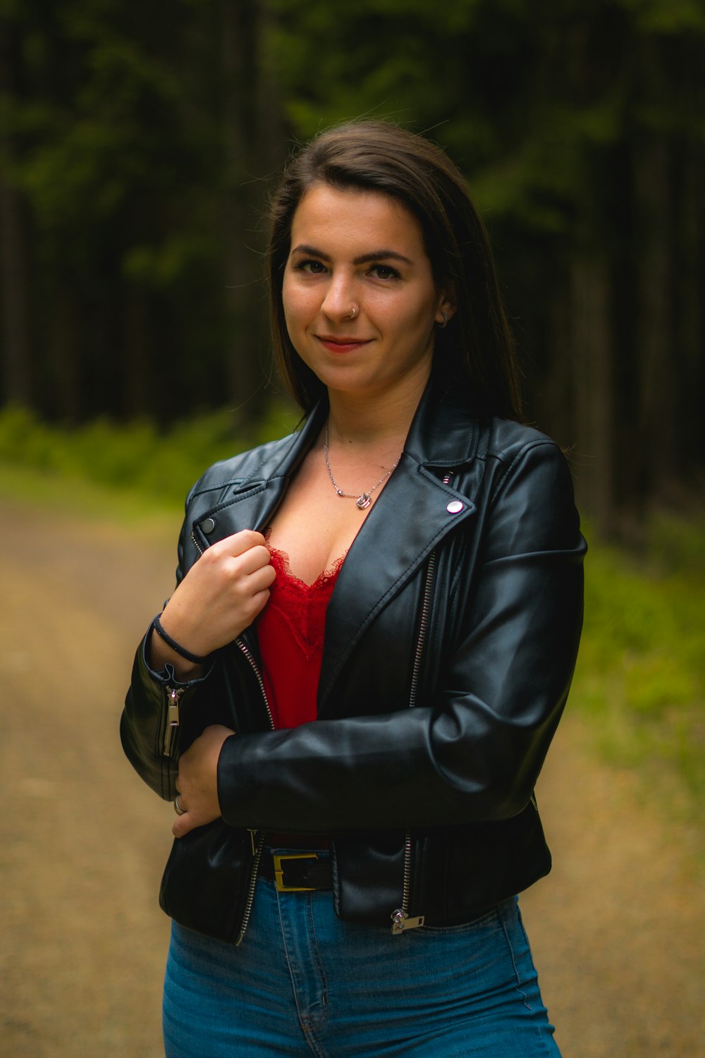 woman in black leather jacket smiling