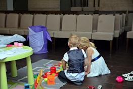 Children playing with toys provided by the union during a community event.