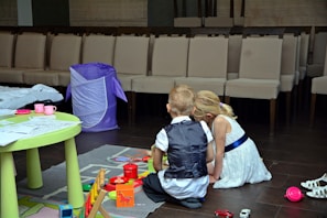 Children engaged in a playful therapy session with colorful toys.