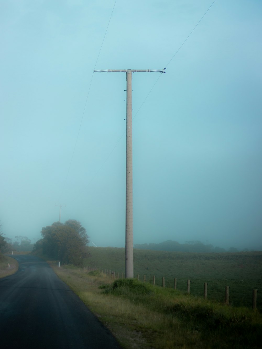 black car on road under gray sky