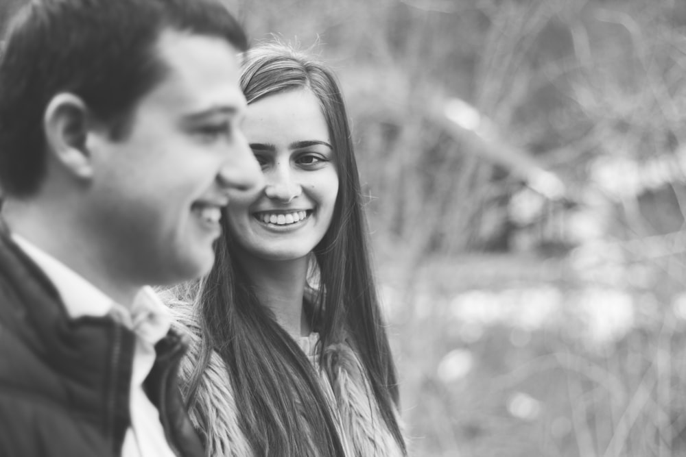 grayscale photo of smiling woman