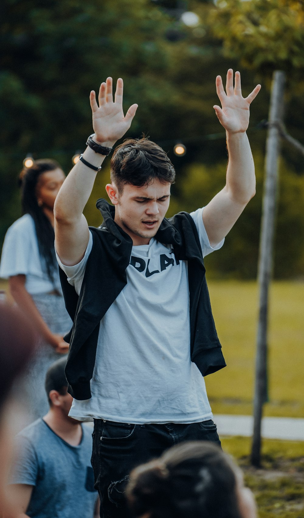 man in black and white adidas shirt