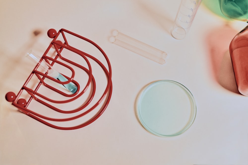 red and silver wire on white table