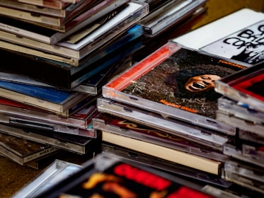 An artistic shot of several colorful Minidiscs scattered on a wooden table.