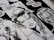Close-up of a detailed semi-realistic comic panel showing expressive characters in action.