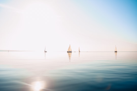 white sail boat on sea during daytime in Kalamaria Greece