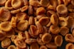 brown almond nuts on brown wooden surface