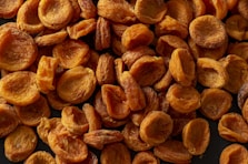 brown almond nuts on brown wooden surface