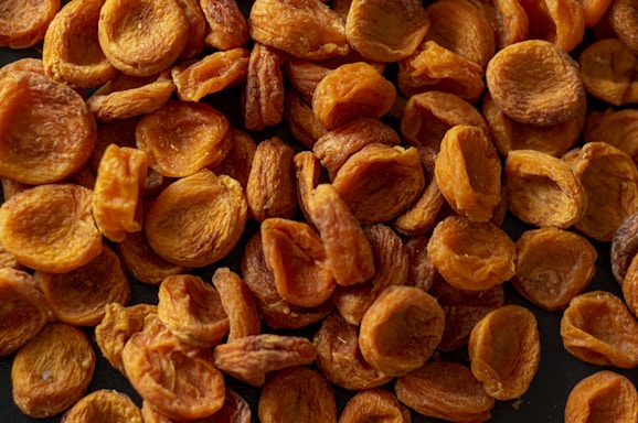 brown almond nuts on brown wooden surface