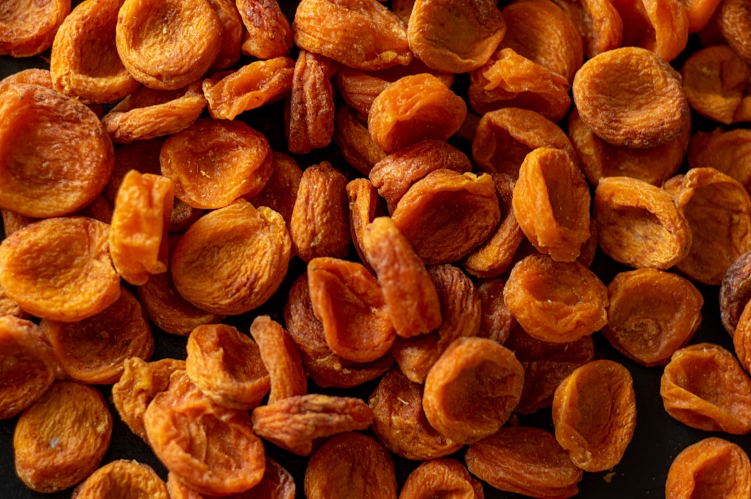 brown almond nuts on brown wooden surface