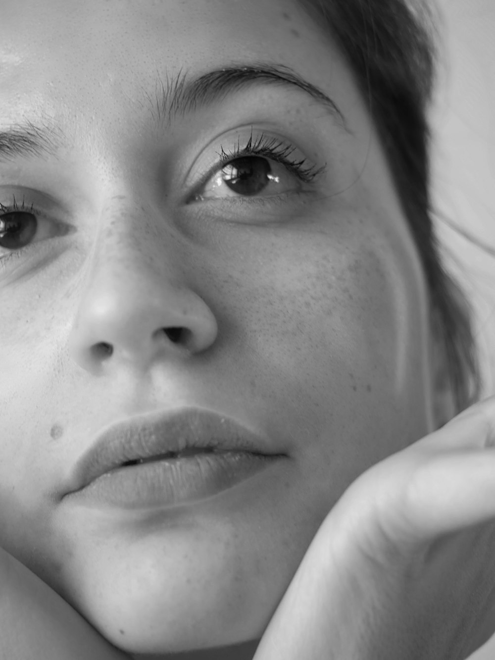 grayscale photo of womans face