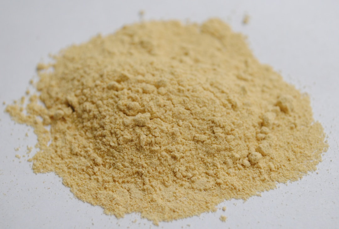 brown powder on white surface, Fenugreek powder