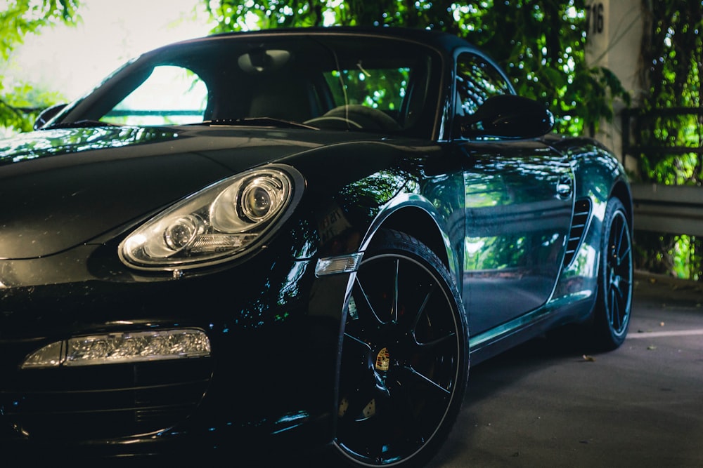 black porsche 911 parked on gray pavement