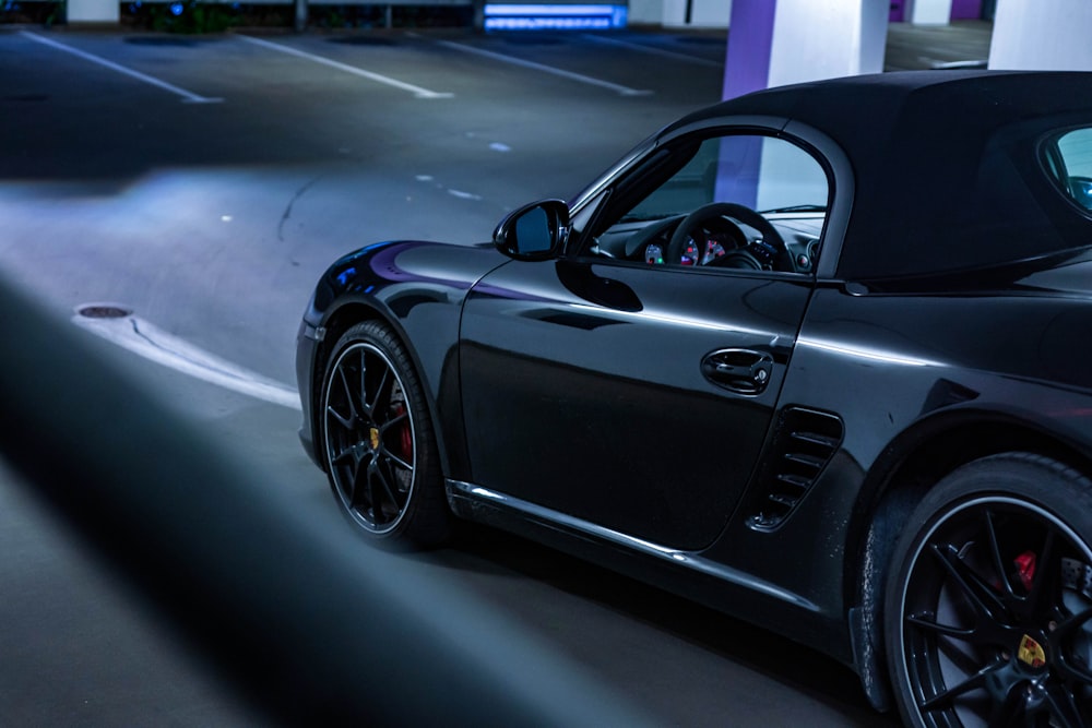 black porsche 911 parked in parking lot