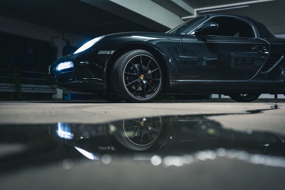 black porsche 911 parked on parking lot