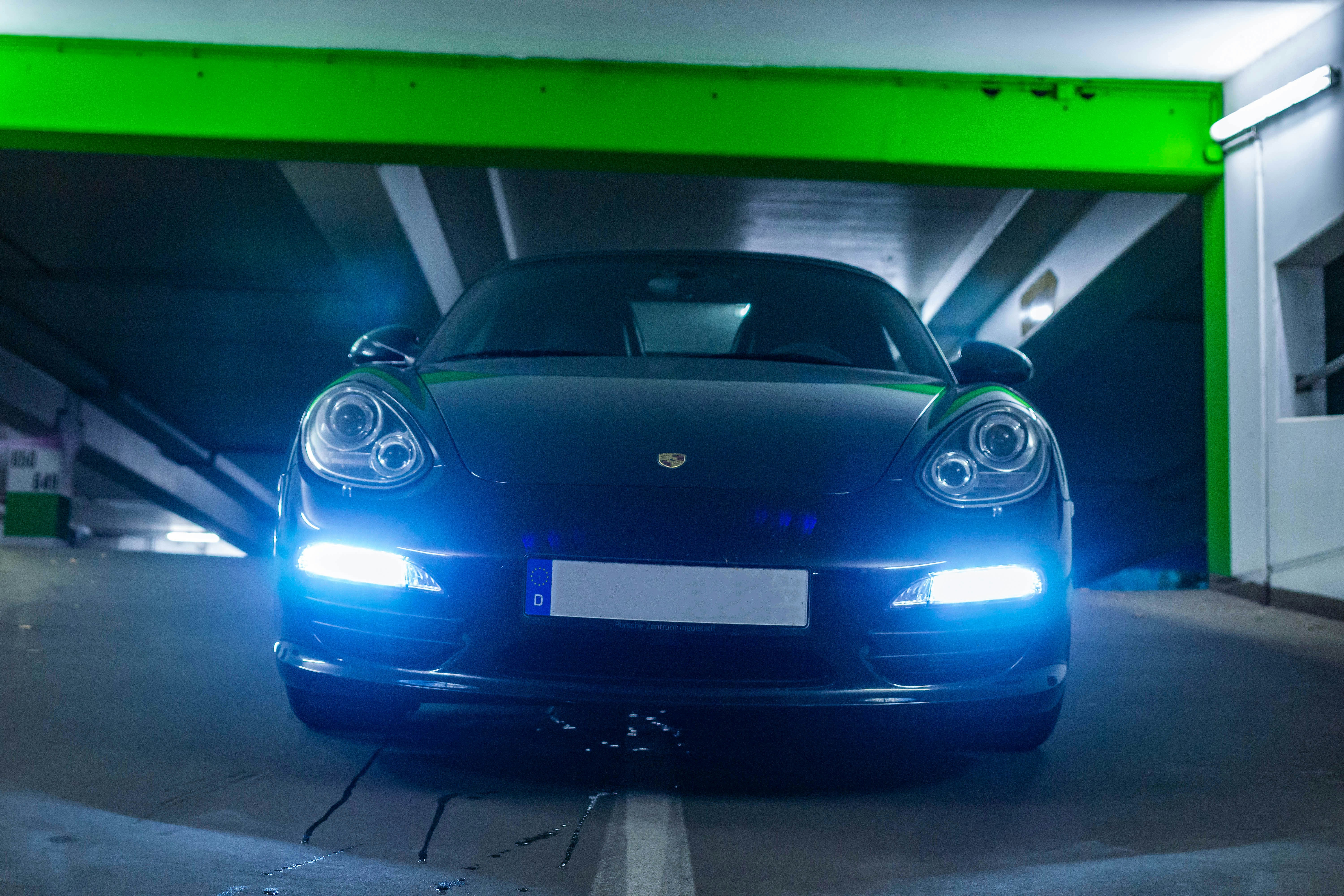 Blue porsche 911 parked in garage